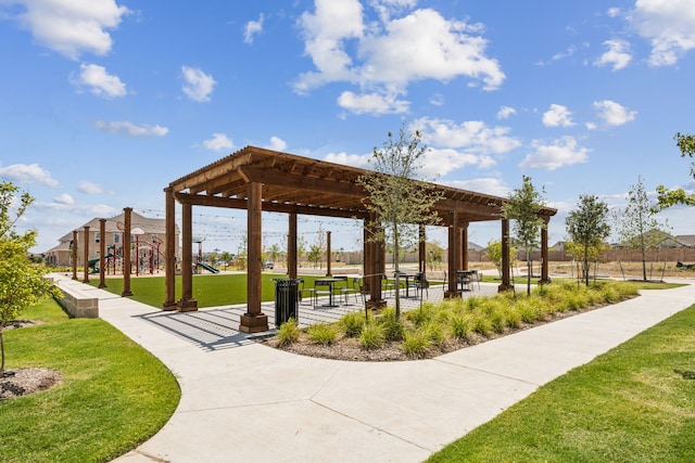 surrounding community with a lawn and playground community