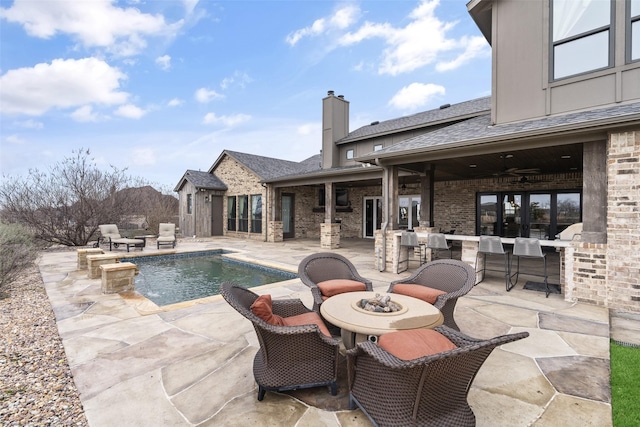 3200 W Fm 455, Celina, TX 75009 - pool with an outdoor fire pit, a patio area, and a ceiling fan
