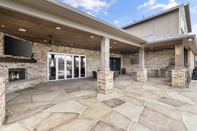 3200 W Fm 455, Celina, TX 75009 - view of patio featuring exterior kitchen, an outdoor brick fireplace, a ceiling fan, and french doors