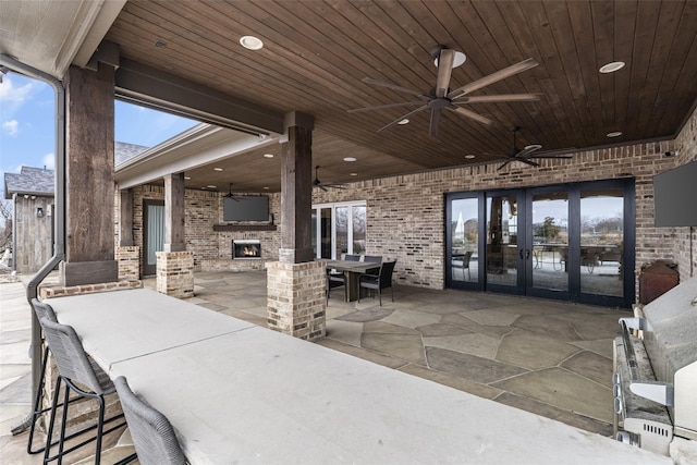 3200 W Fm 455, Celina, TX 75009 - view of patio / terrace featuring french doors, a fireplace, and a ceiling fan