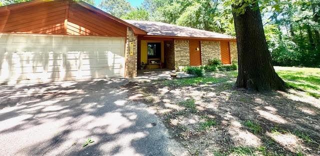 23319 Penninsula Pt, Frankston, TX 75763 - view of front of house with an attached garage and driveway