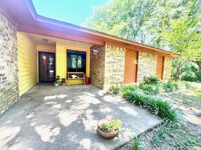 23319 Penninsula Pt, Frankston, TX 75763 - doorway to property with brick siding