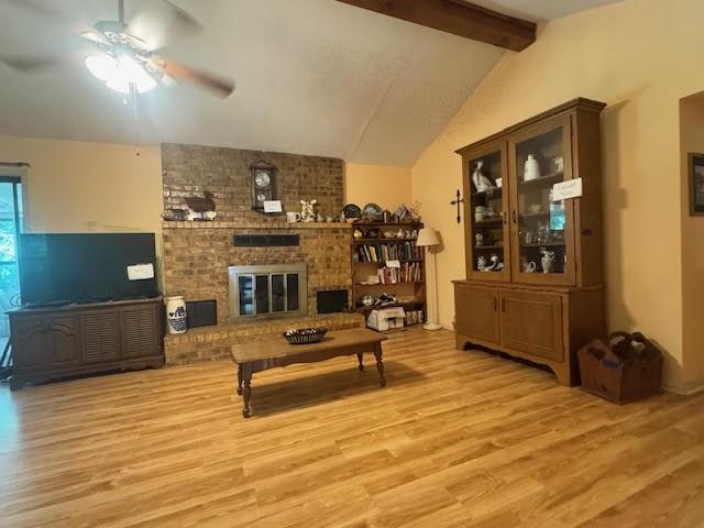 23319 Penninsula Pt, Frankston, TX 75763 - living area featuring ceiling fan, wood finished floors, and a brick fireplace