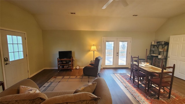 living room featuring plenty of natural light, french doors, and lofted ceiling