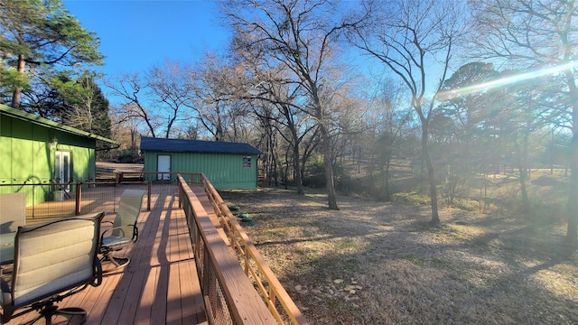 wooden deck featuring an outbuilding