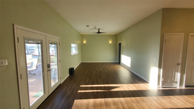 interior space featuring ceiling fan, baseboards, dark wood-style flooring, and french doors