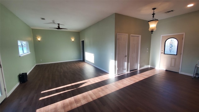 foyer featuring a ceiling fan, baseboards, visible vents, and wood finished floors