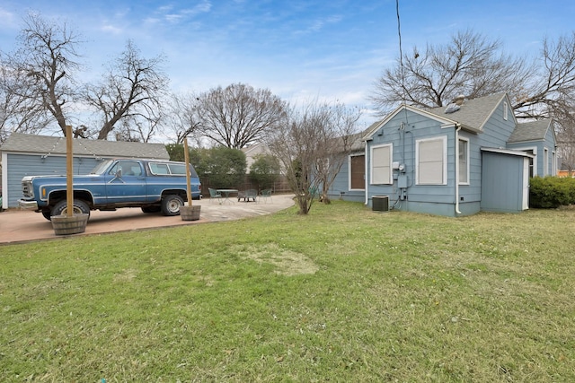 view of yard featuring a patio and central AC unit