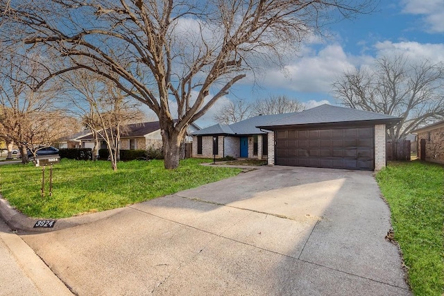 view of front of property with a garage, a shingled roof, concrete driveway, a front lawn, and brick siding