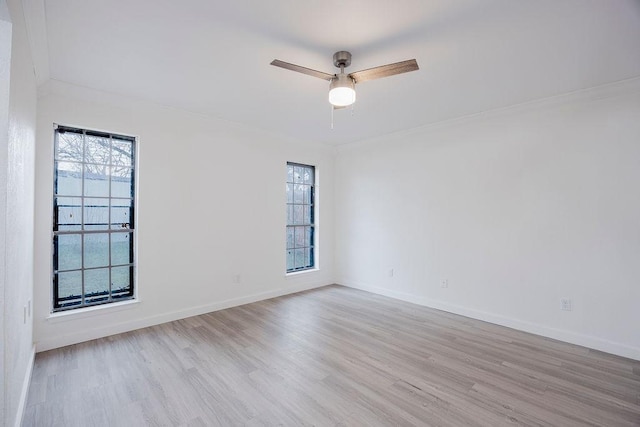 empty room with light wood-type flooring, ceiling fan, and baseboards