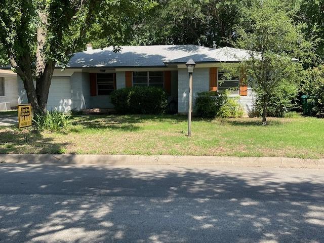 3304 Avon Dr, Denton, TX 76209 - ranch-style home with a garage and a front yard