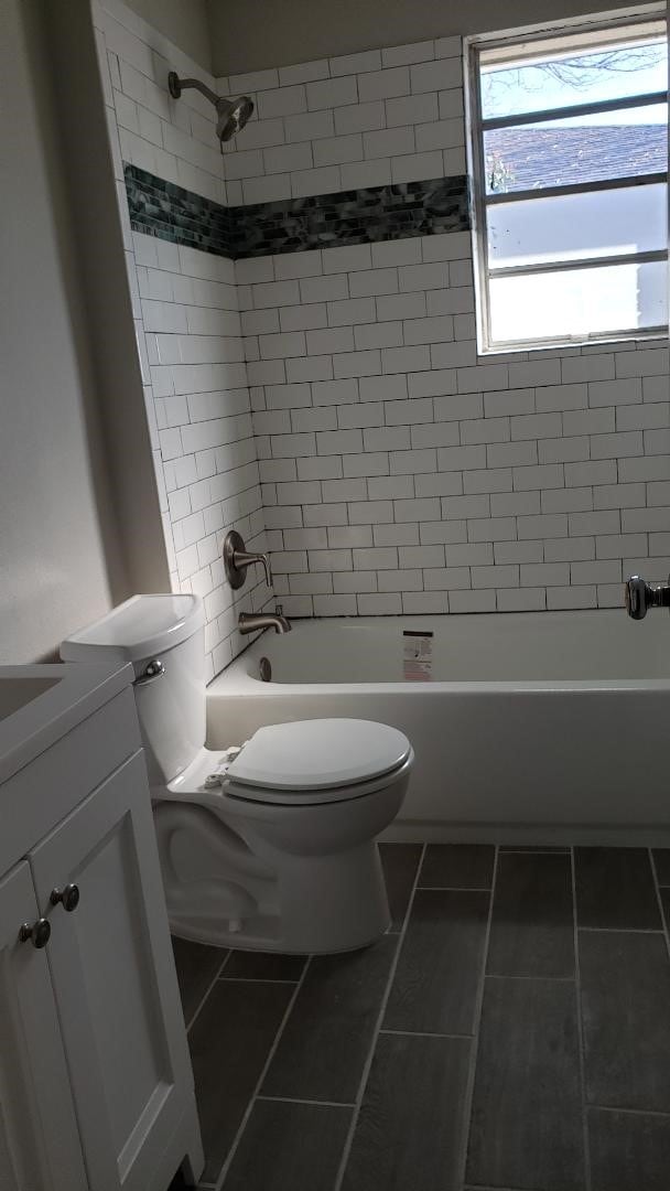 3304 Avon Dr, Denton, TX 76209 - full bath with toilet, vanity, shower / bath combination, and tile patterned flooring