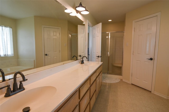 bathroom featuring a shower stall and a sink