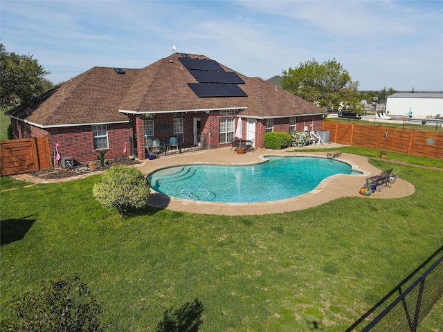 view of pool with a patio, a lawn, a fenced backyard, and a fenced in pool