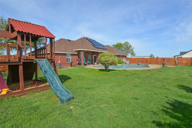 view of jungle gym with a fenced in pool, a patio area, a fenced backyard, and a yard