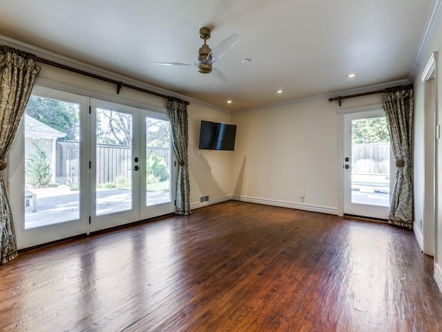 spare room with visible vents, dark wood-style floors, ornamental molding, french doors, and recessed lighting