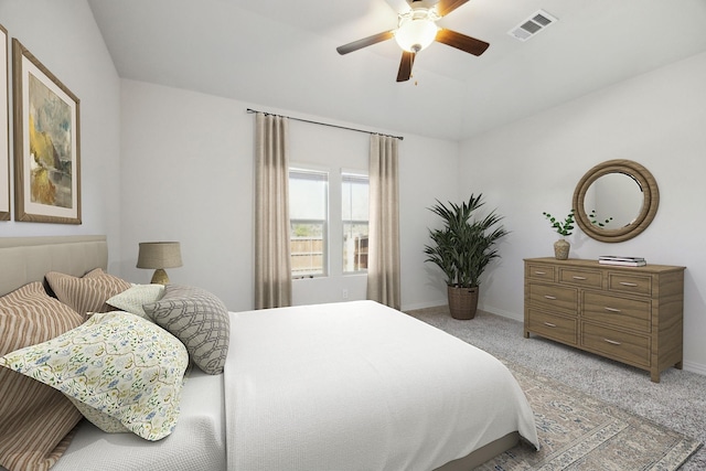 bedroom featuring lofted ceiling, visible vents, light carpet, and baseboards