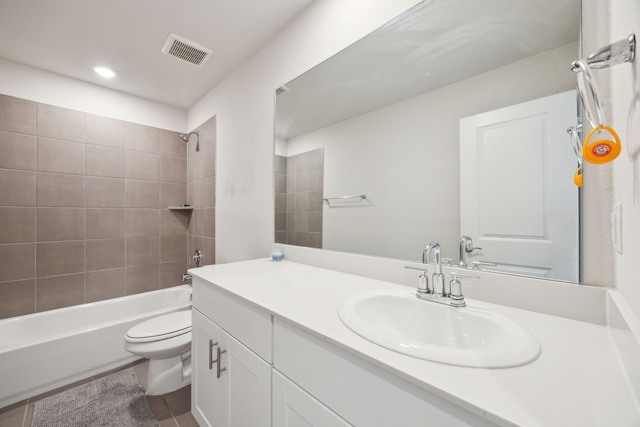 bathroom featuring toilet, bathtub / shower combination, visible vents, and vanity