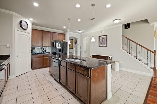 kitchen featuring ornamental molding, a sink, a center island with sink, and black appliances