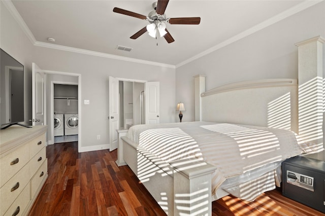 bedroom featuring visible vents, baseboards, independent washer and dryer, dark wood finished floors, and crown molding