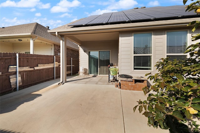 rear view of house featuring a patio and fence