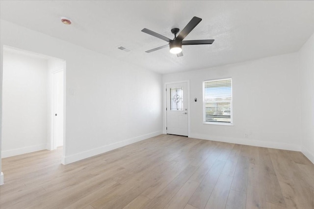 foyer with ceiling fan, baseboards, visible vents, and light wood-style floors