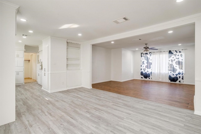 empty room featuring light wood-type flooring, visible vents, a ceiling fan, and recessed lighting