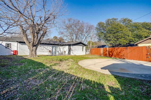 view of yard featuring a patio area and fence