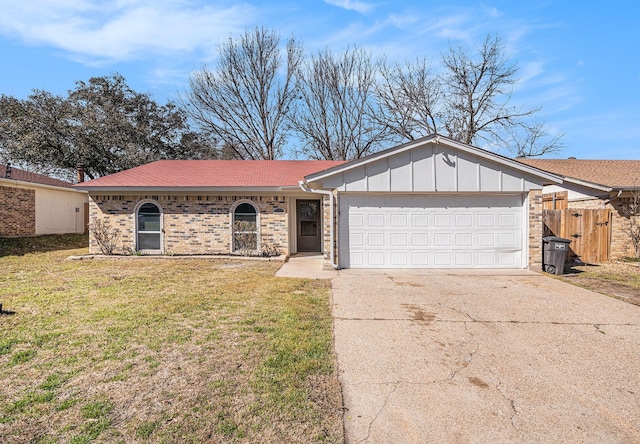 ranch-style house with driveway, brick siding, an attached garage, board and batten siding, and a front yard