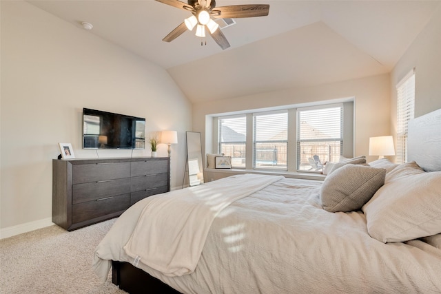 bedroom with lofted ceiling, light carpet, ceiling fan, and baseboards