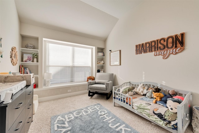 bedroom with vaulted ceiling, baseboards, and light colored carpet