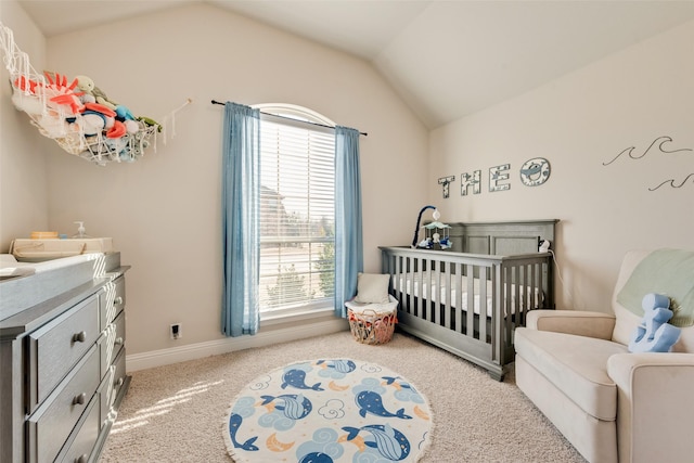 bedroom featuring light carpet, a nursery area, baseboards, and vaulted ceiling