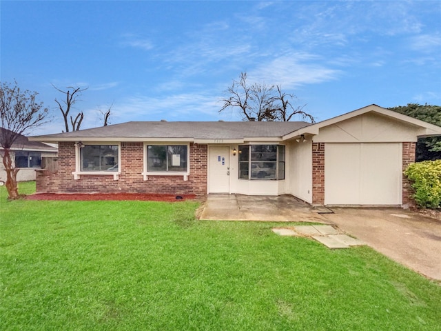 ranch-style home with a garage, concrete driveway, a front lawn, and brick siding