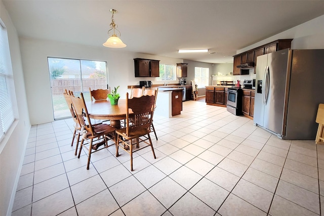 dining space with light tile patterned floors