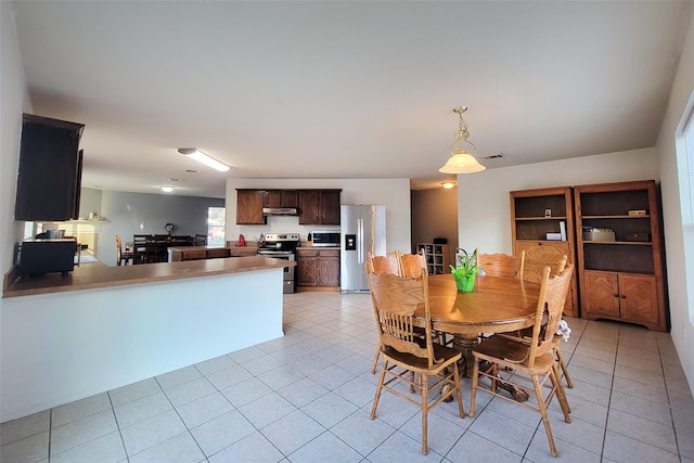 dining room featuring light tile patterned flooring