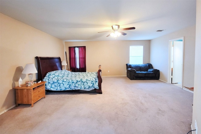 bedroom featuring ceiling fan, carpet, visible vents, and baseboards