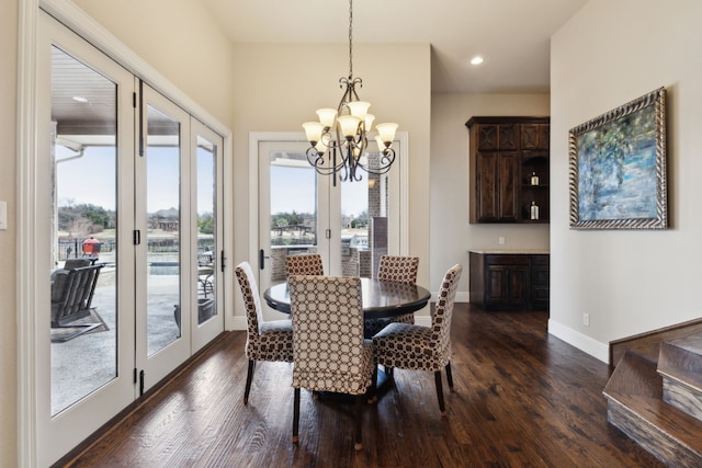 dining space with plenty of natural light, dark wood-style flooring, and french doors