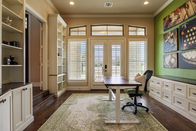 home office featuring a healthy amount of sunlight, visible vents, dark wood-style flooring, and ornamental molding