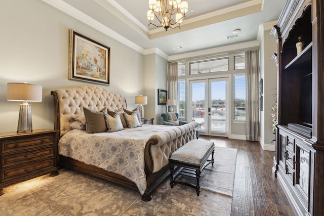 bedroom featuring visible vents, a raised ceiling, ornamental molding, access to exterior, and french doors