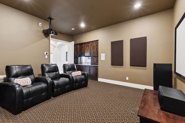 carpeted cinema with recessed lighting and baseboards