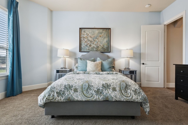 bedroom with carpet and baseboards