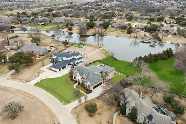 birds eye view of property featuring a water view and a residential view