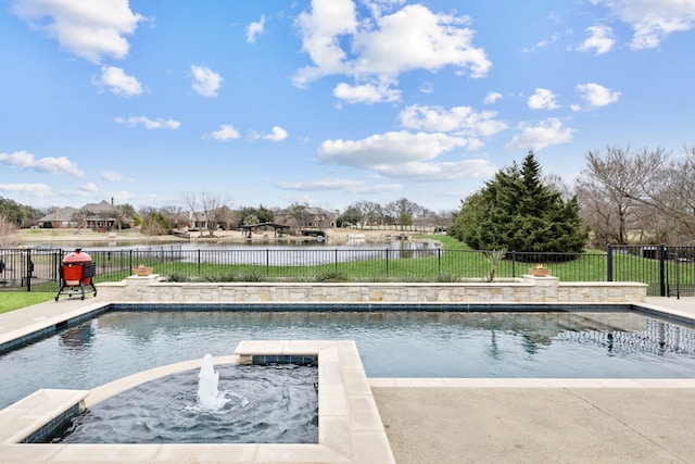 view of swimming pool featuring fence