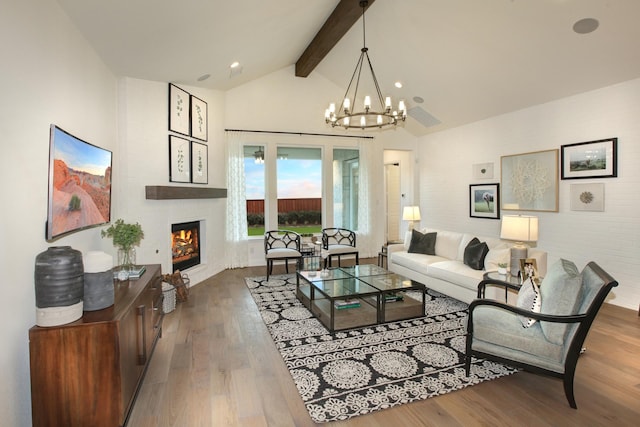 1909 Paxton Pass, Mckinney, TX 75071 - living room featuring wood finished floors, a chandelier, a fireplace, and recessed lighting