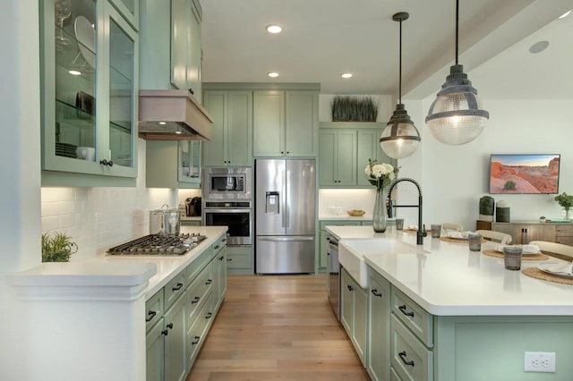 1909 Paxton Pass, Mckinney, TX 75071 - kitchen featuring appliances with stainless steel finishes, a sink, green cabinetry, light countertops, and recessed lighting