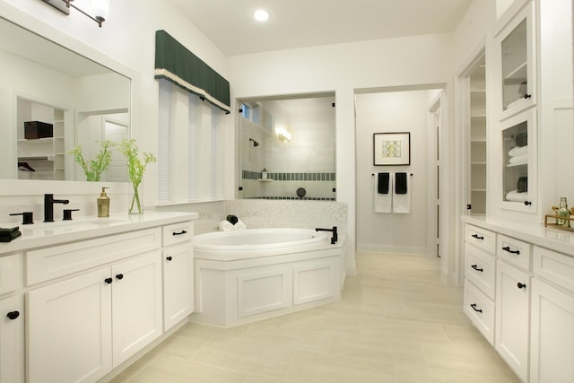 1909 Paxton Pass, Mckinney, TX 75071 - full bath featuring a tile shower, a bath, vanity, tile patterned floors, and recessed lighting