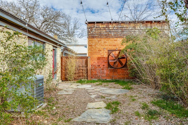 view of yard featuring central air condition unit