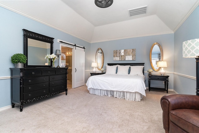 bedroom with a tray ceiling, light colored carpet, visible vents, a barn door, and ornamental molding