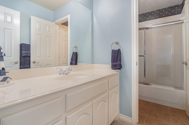 bathroom with vanity, combined bath / shower with glass door, and tile patterned floors