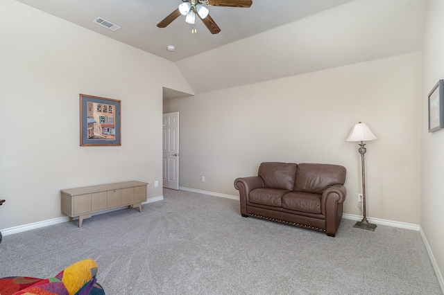 living area featuring light carpet, baseboards, visible vents, ceiling fan, and vaulted ceiling